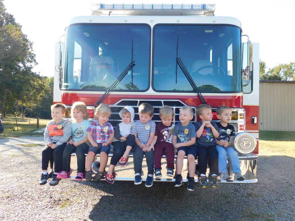 Picture of kids on a fire truck